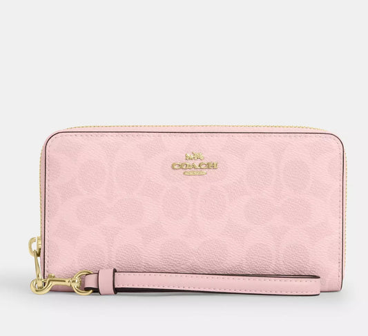 Cartera larga con cremallera en lona de la firma Coach
